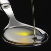 Extra-Virgin Olive Oil Polyphenols Improve HDL olive oil on a spoon