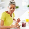 #8 TOP READ / WHITE PAPER: Managing Metabolic Processes of Osteoarthritis with Botanicals Mature Woman Eating Breakfast And Reading Newspaper
