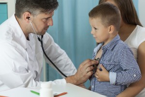 Boy with mother during medical appointment